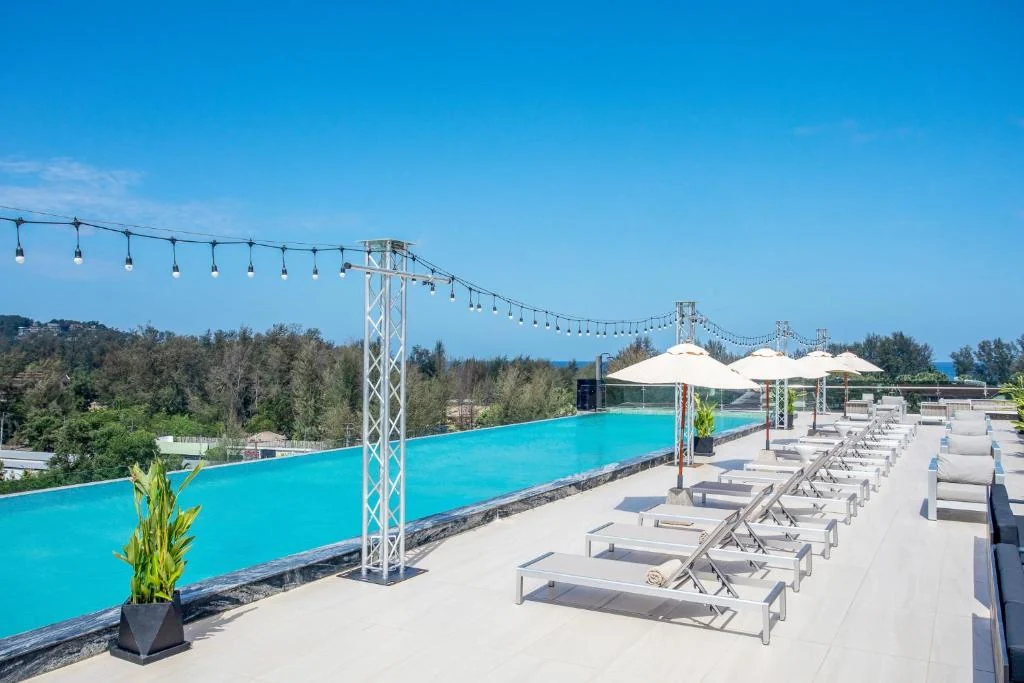 Rooftop infinity pool and sun loungers at Andaman Riviera