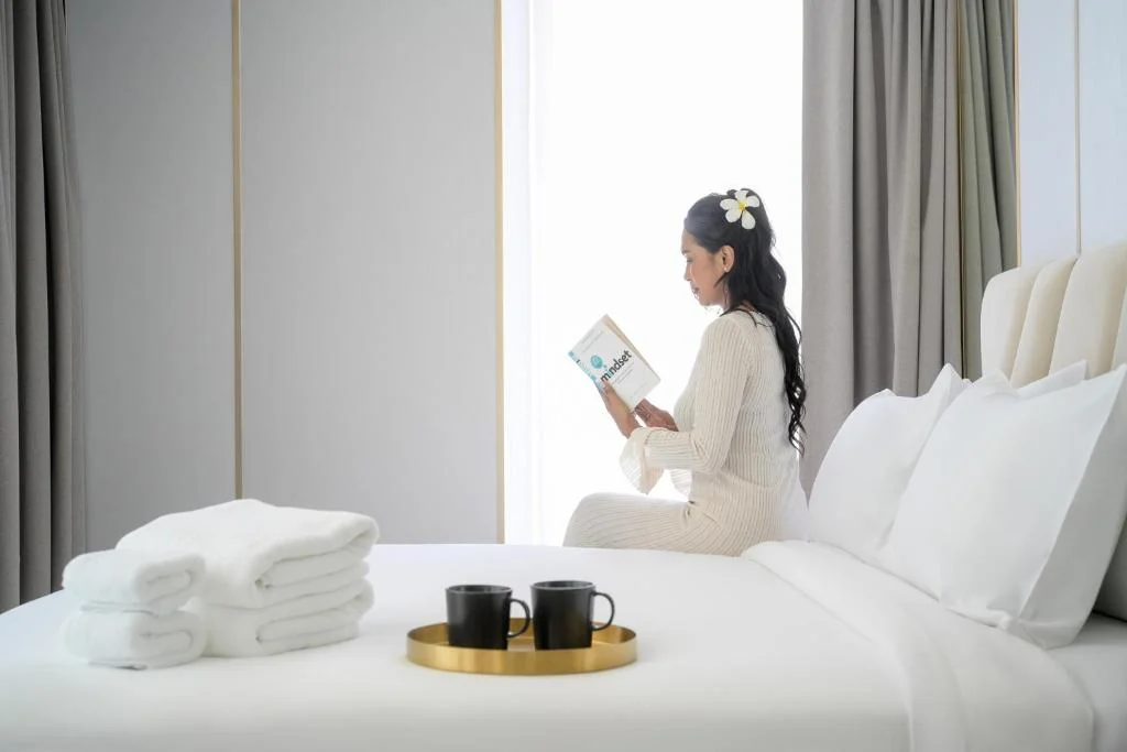 Bright guest-room bed area in the Studio room at Andaman Riviera